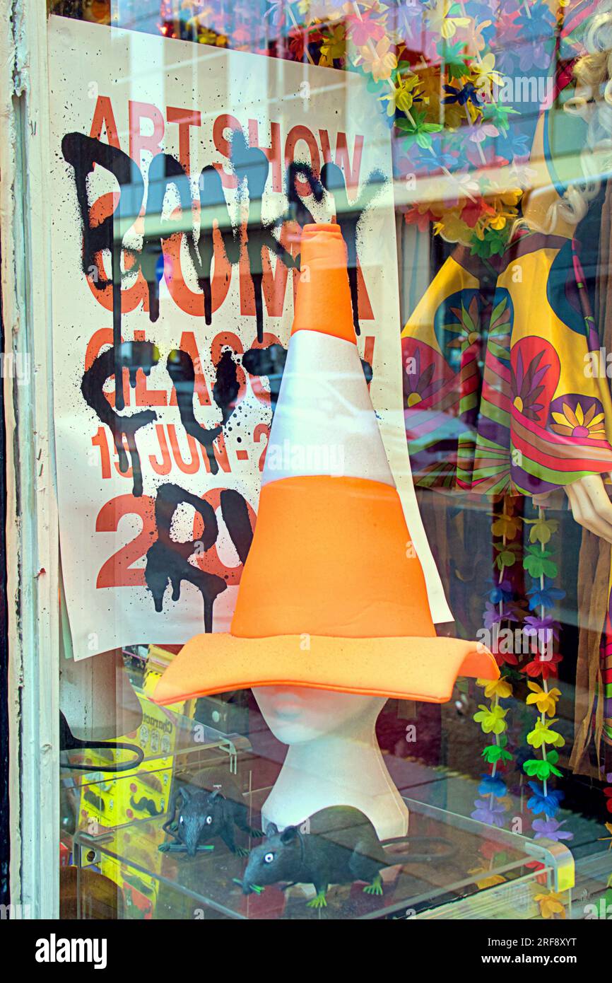 Glasgow, Scotland, UK 31st July, 2023. A glasgow joke shop tam shepherds was one of the places banksy himself chose to be a suitable place to display a poster and they supplied the cone and rats. Credit Gerard Ferry/Alamy Live News Stock Photo