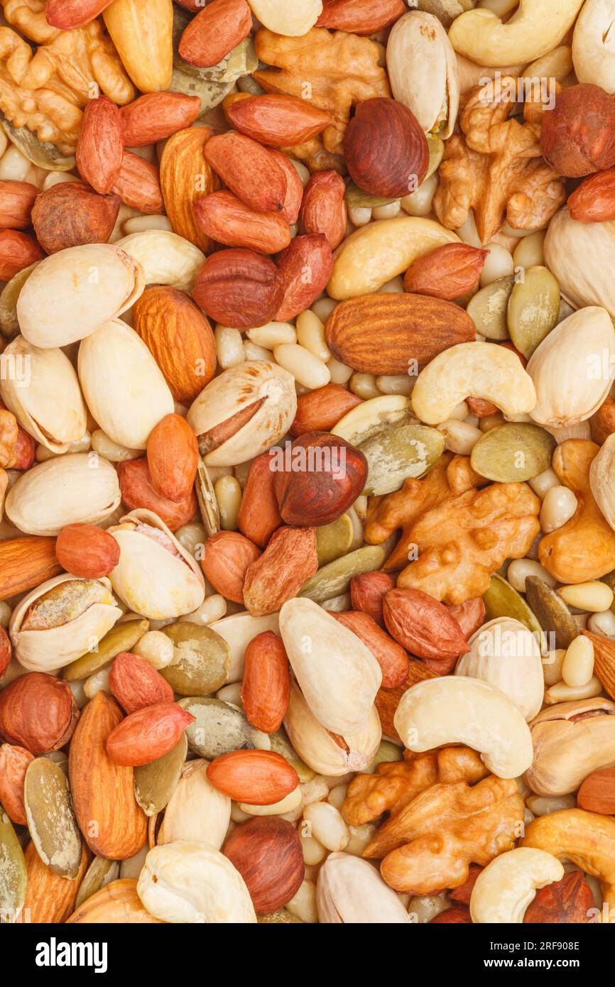Background from different types of nuts and seeds peeled walnut