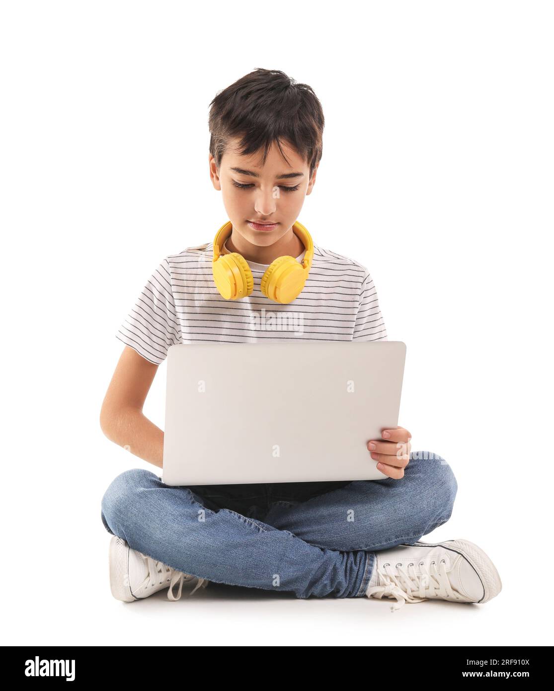 Little boy using laptop on white background Stock Photo - Alamy