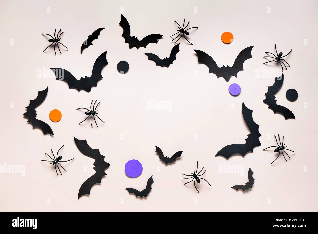Frame made of paper bats and spiders for Halloween party on grey ...