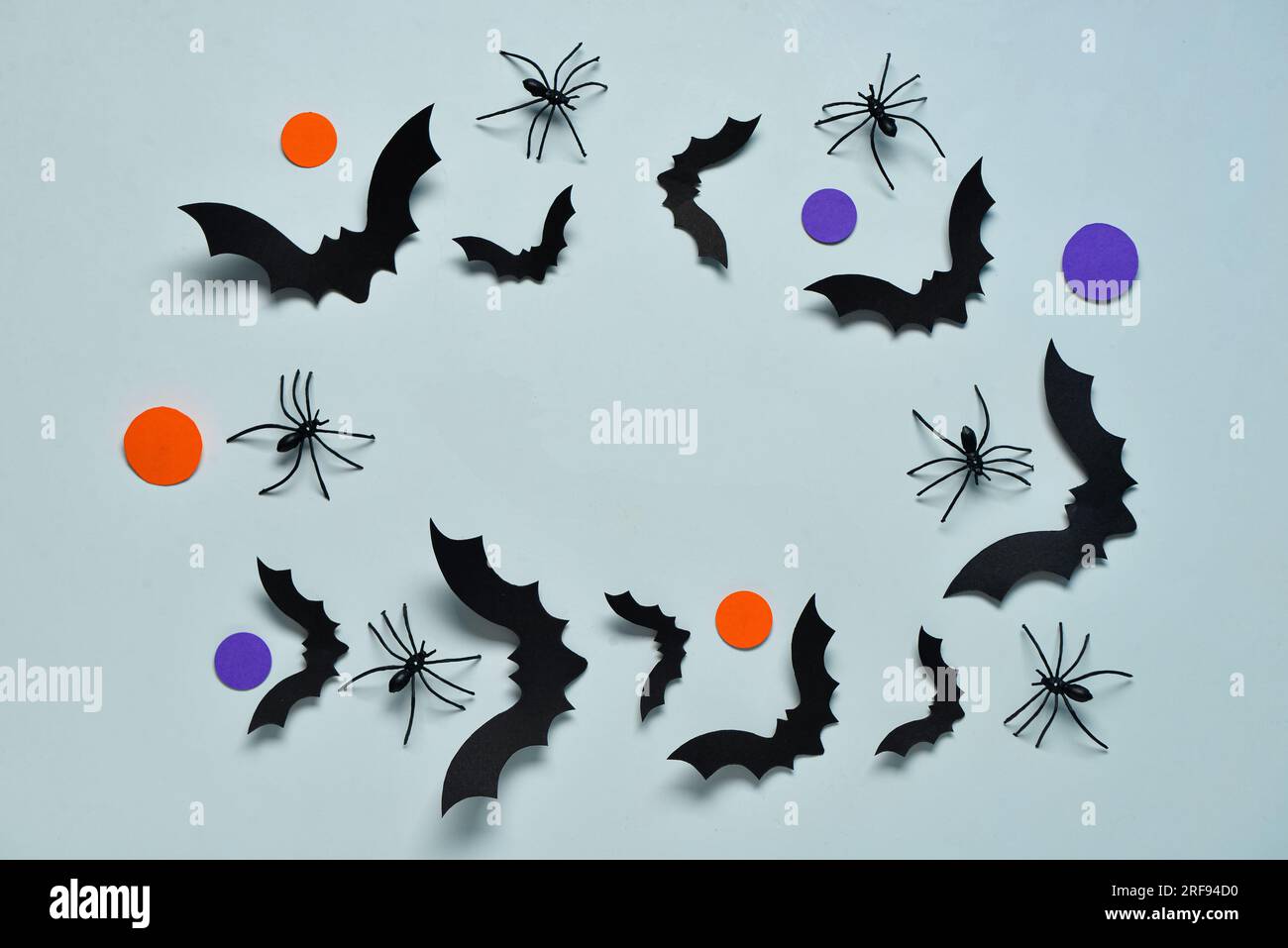 Frame made of paper bats and spiders for Halloween party on blue ...
