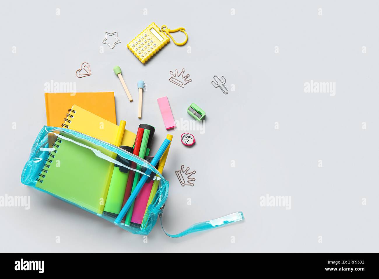 Pencil case with different school stationery on light background Stock Photo
