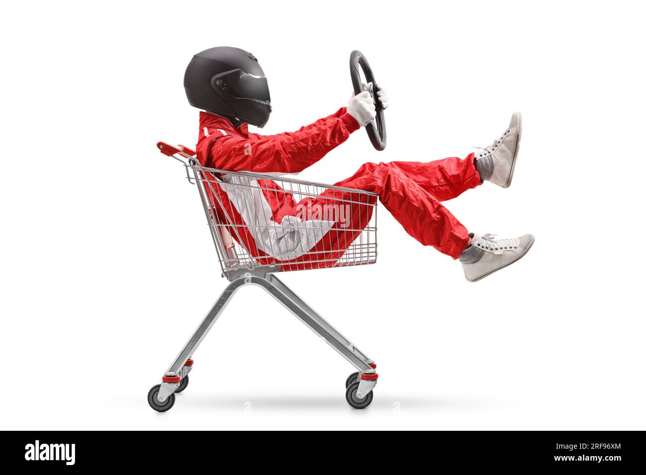 Racer holding a steering wheel and sitting inside a shopping cart isolated on white background