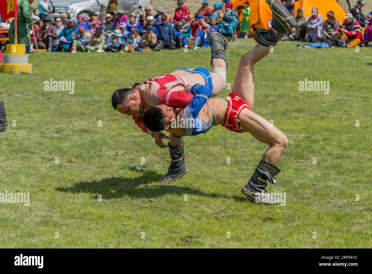 The Mongolian traditional wrestling event (is an untimed competition in which wrestlers lose if they touch the ground with any part of their body othe Stock Photo