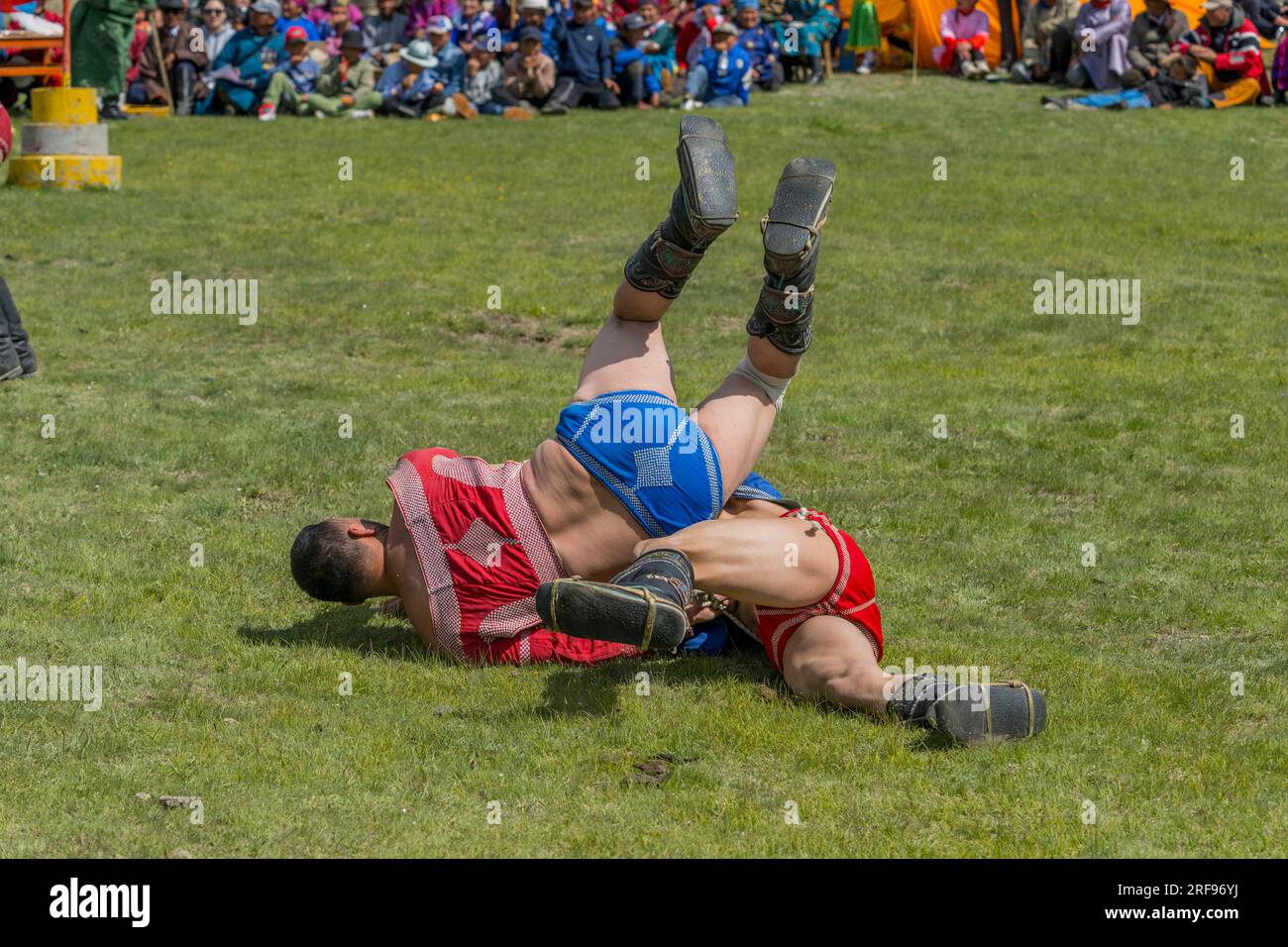 The Mongolian traditional wrestling event (is an untimed competition in which wrestlers lose if they touch the ground with any part of their body othe Stock Photo