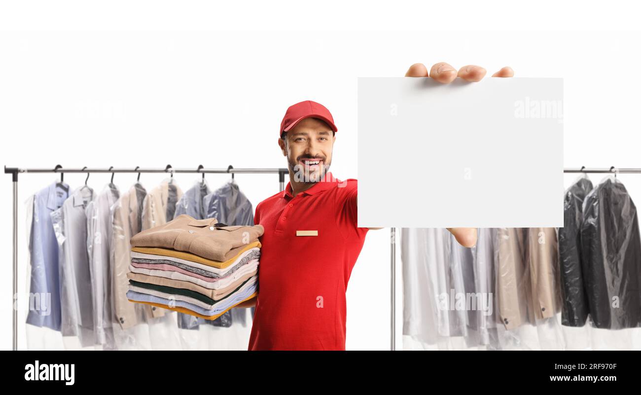 https://c8.alamy.com/comp/2RF970F/laundry-worker-holding-a-pile-of-clothes-and-showing-a-blank-card-at-the-dry-cleaners-isolated-on-white-background-2RF970F.jpg