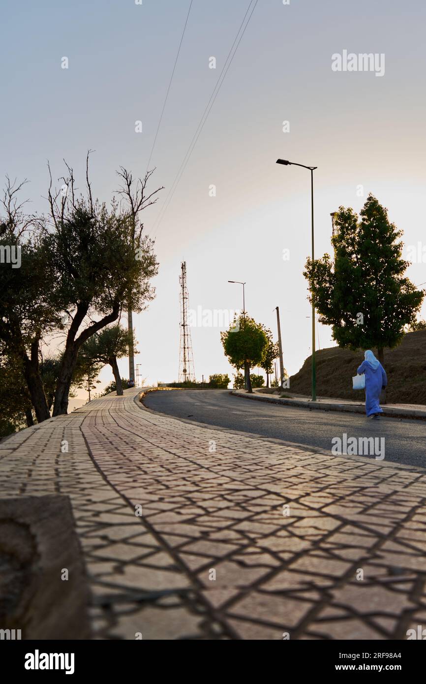 Woman walking on road mediterranean hi-res stock photography and images ...