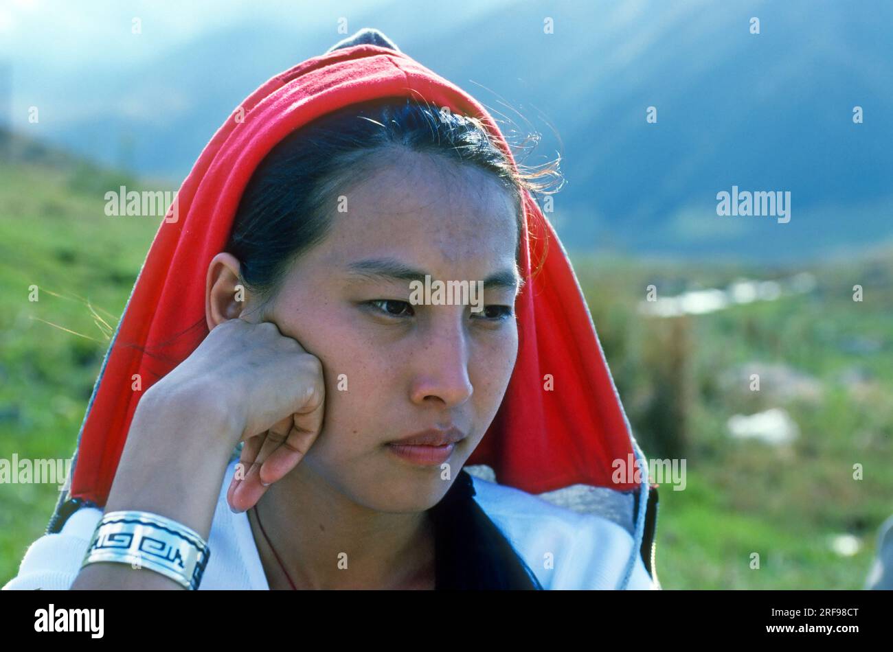 Portrait young Kyrgyz woman in rural countryside Kyrgyzstan Stock Photo