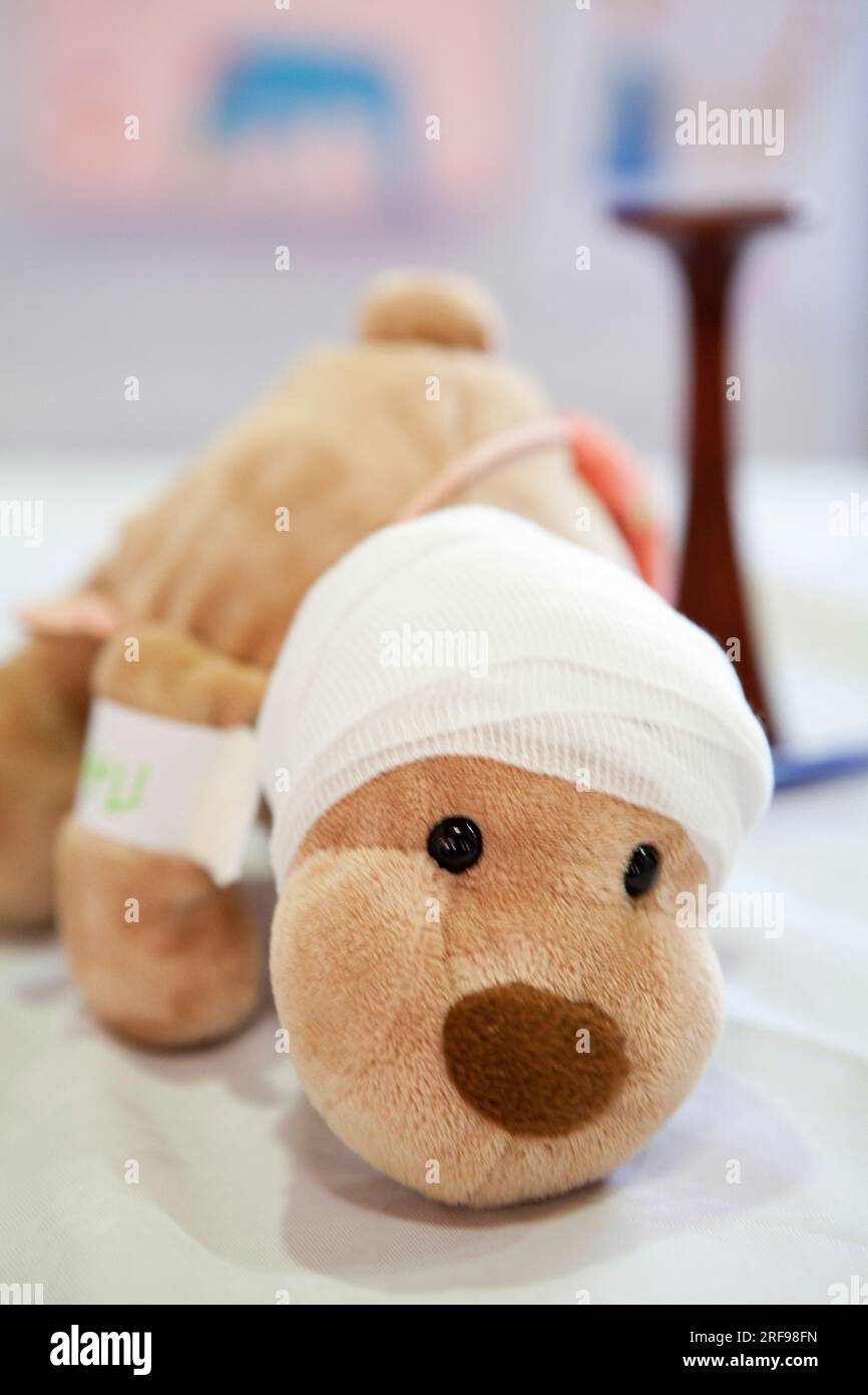 Each child takes their sick cuddly toy to the Teddy Bear Hospital for treatment and the child goes through the different hospital departments. Stock Photo
