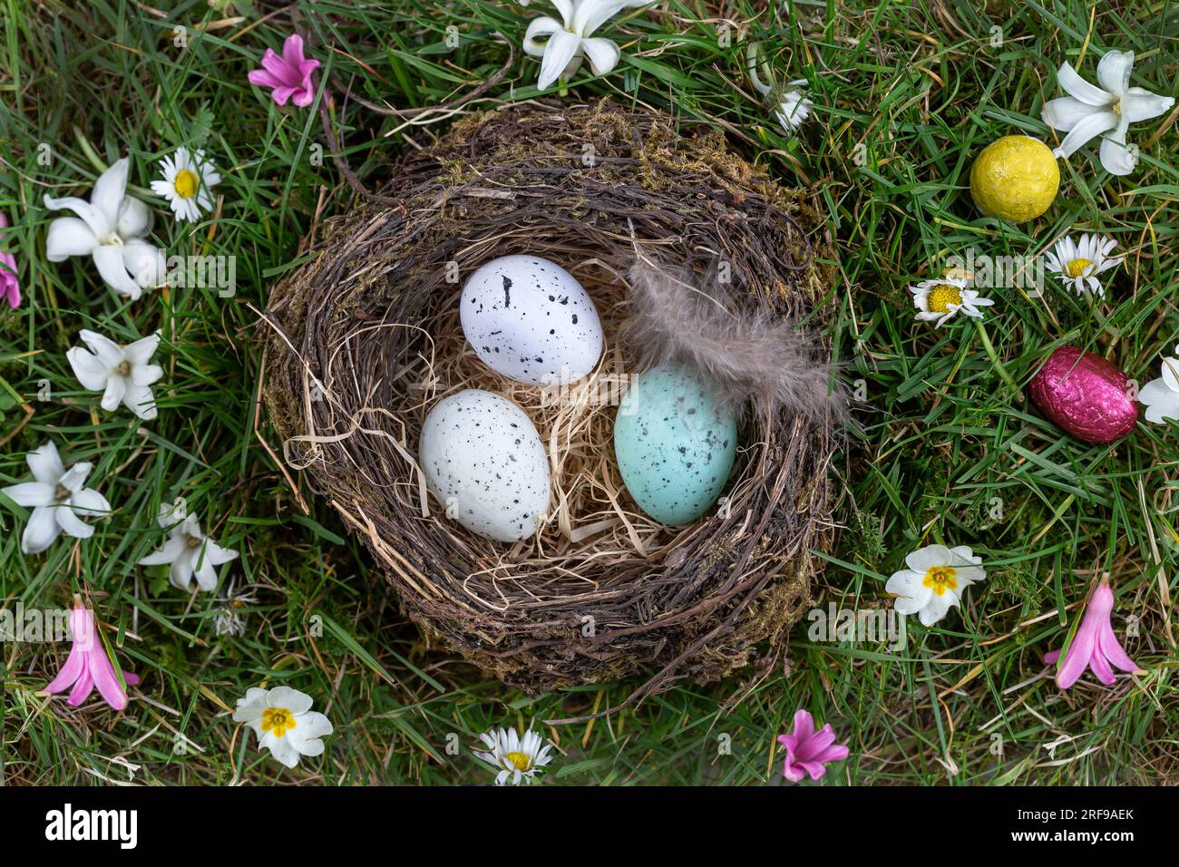 Three Easter eggs in a nest. Stock Photo