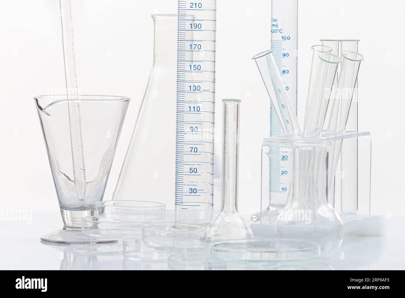 Set of laboratory glassware on plain background Stock Photo - Alamy