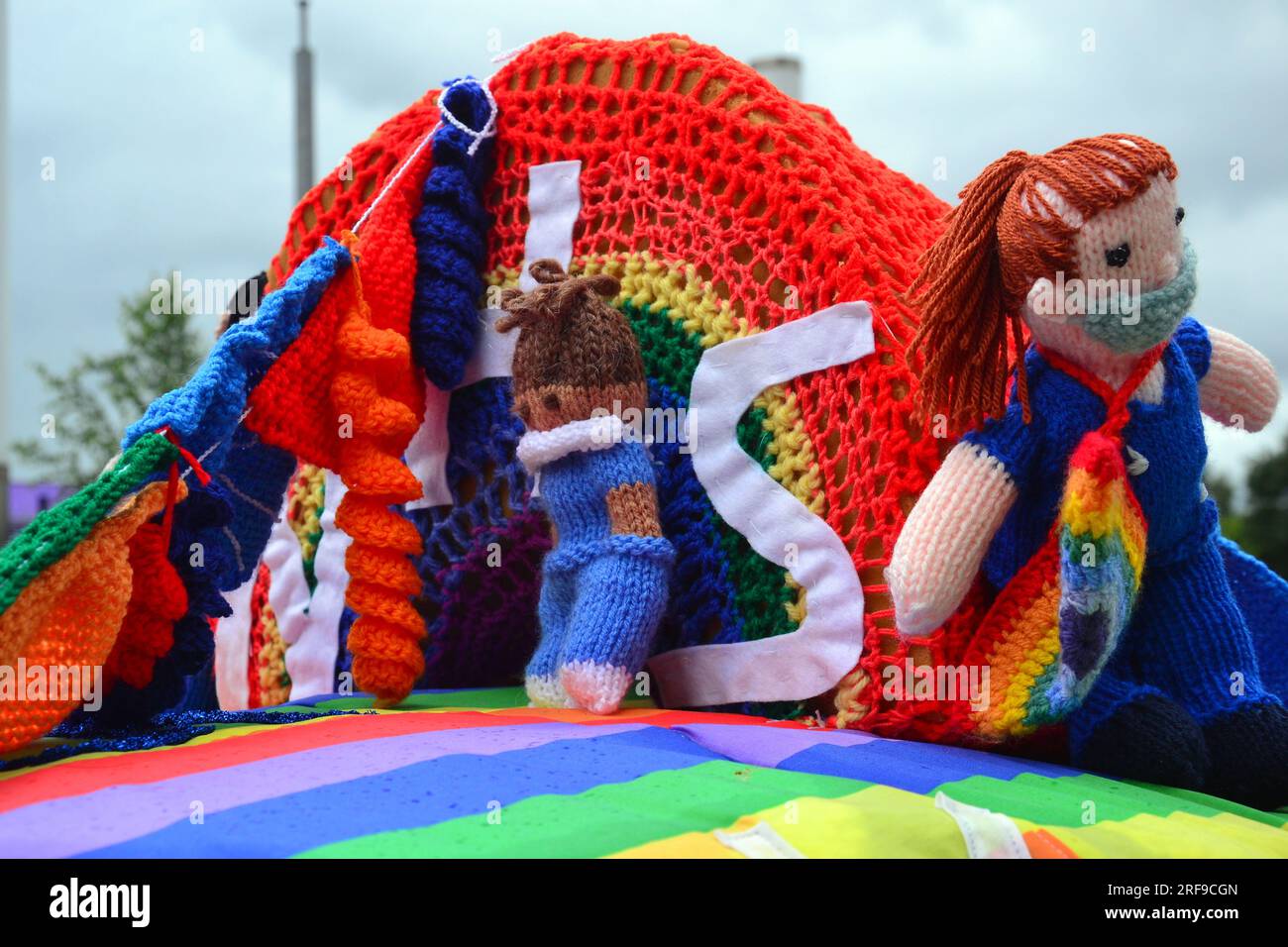 Royal Mail post box, decorated on top knitted NHS sign yarn bombing Stock Photo Alamy