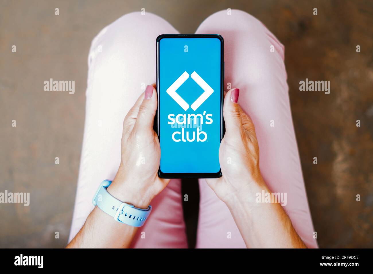 In this photo illustration, the Sam's Club logo is seen displayed on a smartphone screen, Stock Photo