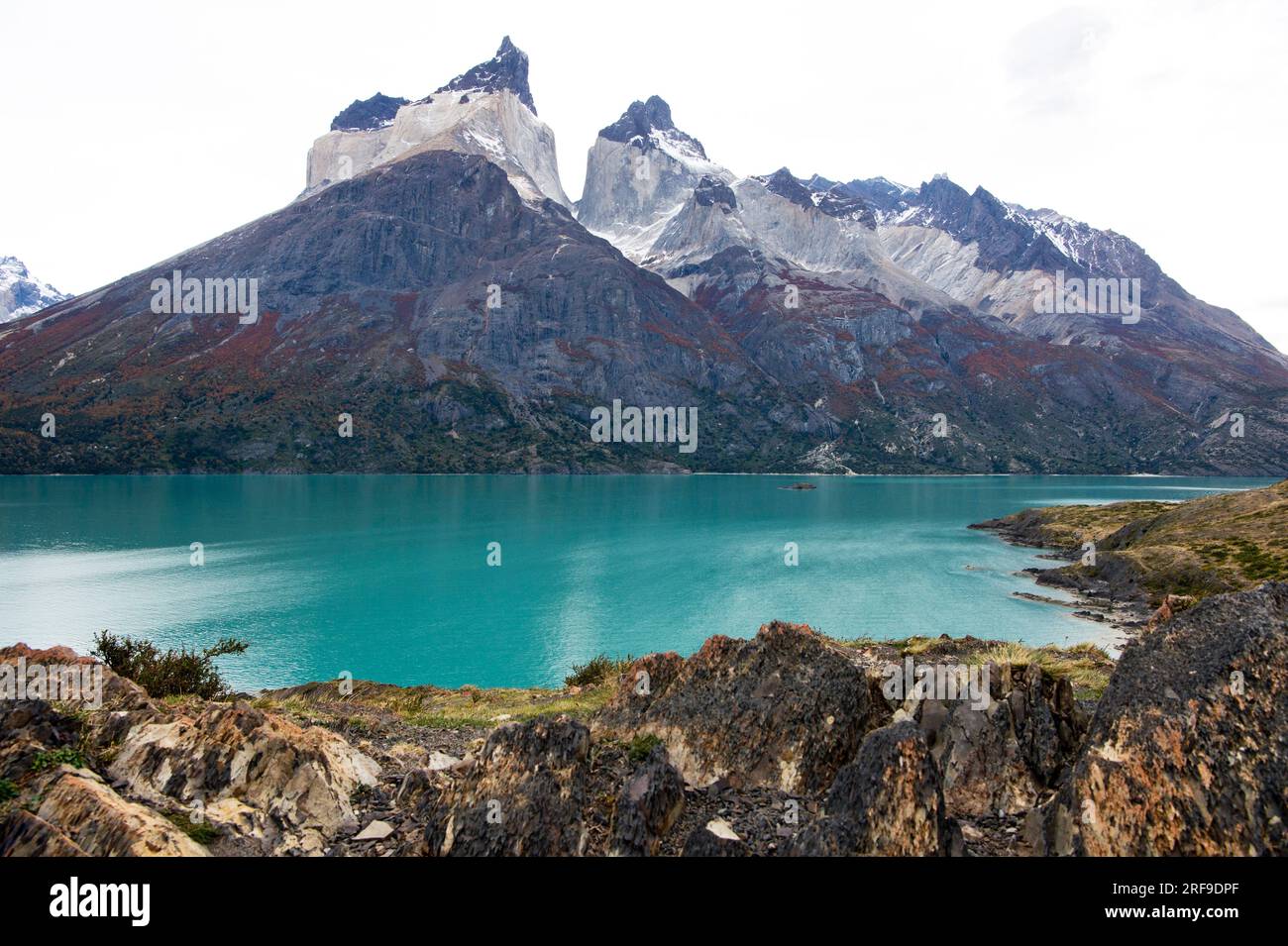 Nordenskjold Lake in front of fall color on the Paine Massif in Torres del Paine National Park in Chile Stock Photo