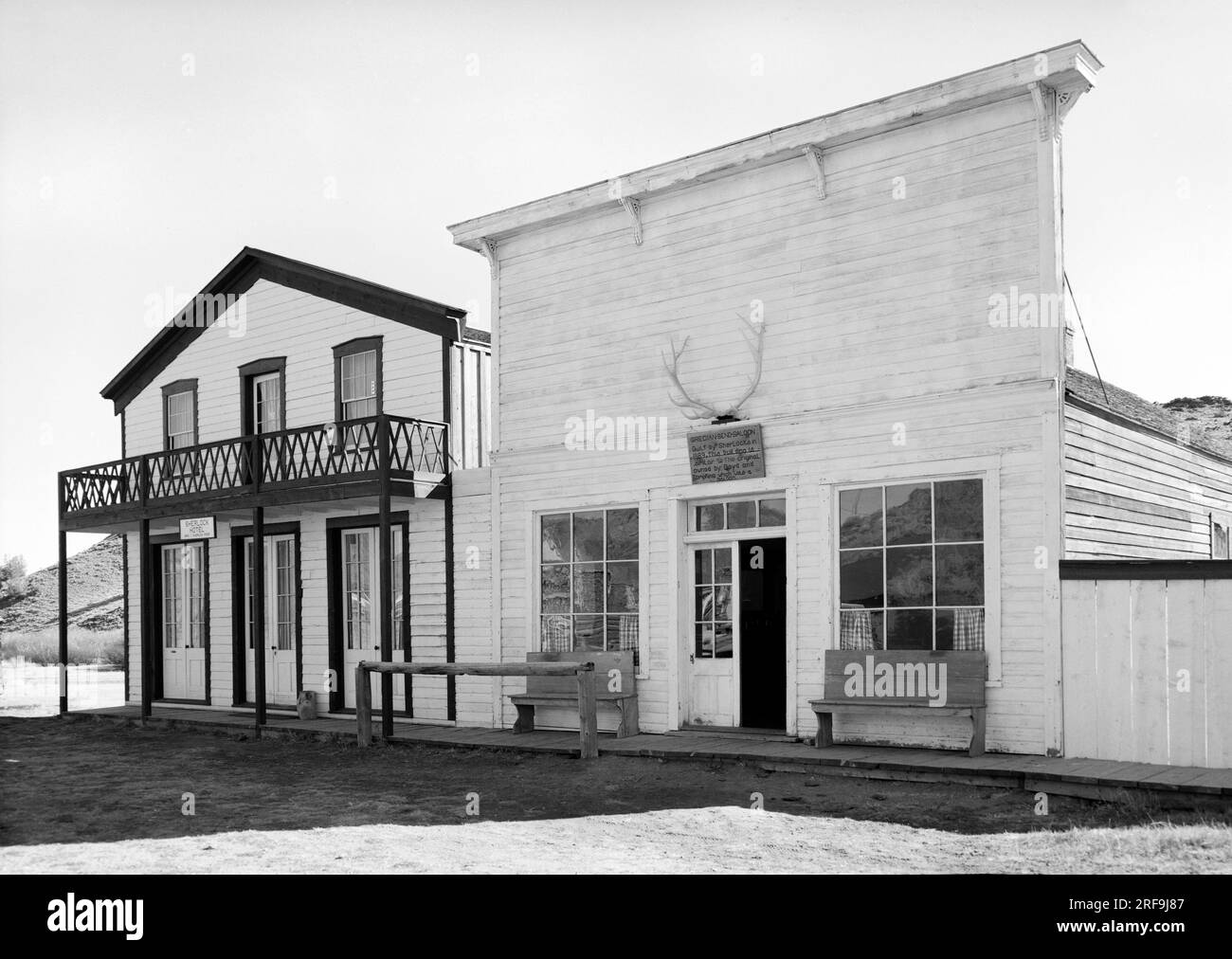 South Pass City, Wyoming:  c. 1930 View of the old Grecian Bend Saloon and the adjacent Sherlock Hotel. Stock Photo