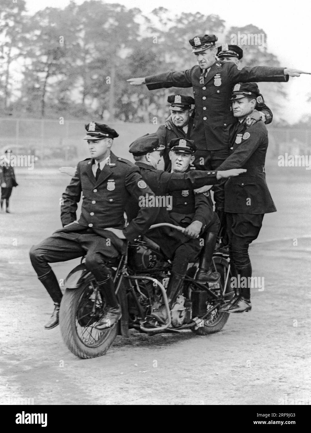 New York, New York:  c. 1937 Members of the New York City Police motorcycle division practice their routines for the upcoming benefit show at Madison Square Garden for the Police Activities League. Stock Photo
