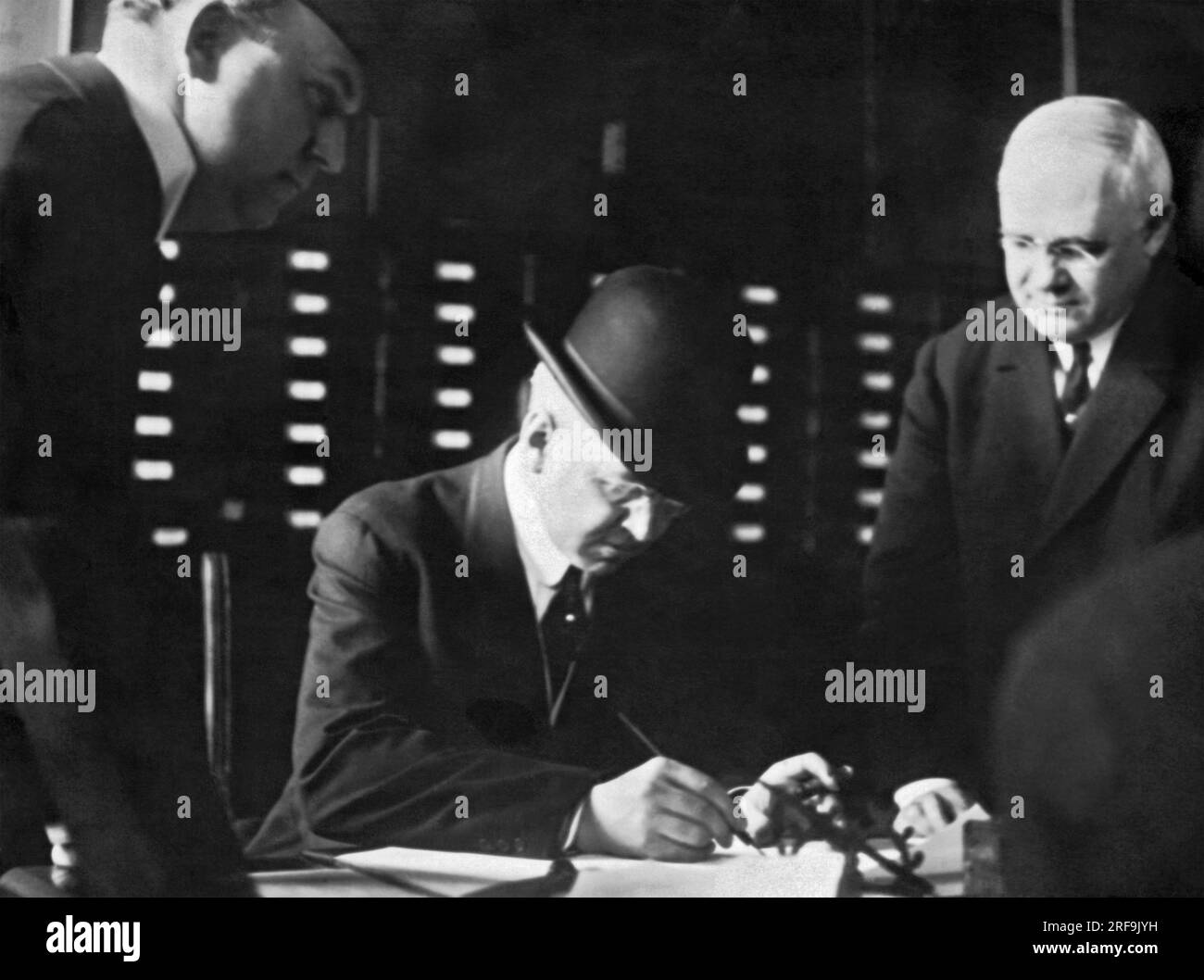 New York, New York    May 2, 1912 Charles H. Hyde, City Chamberlain of New York, signing papers in the D.A.'s office. He is facing charges of bribery. Stock Photo