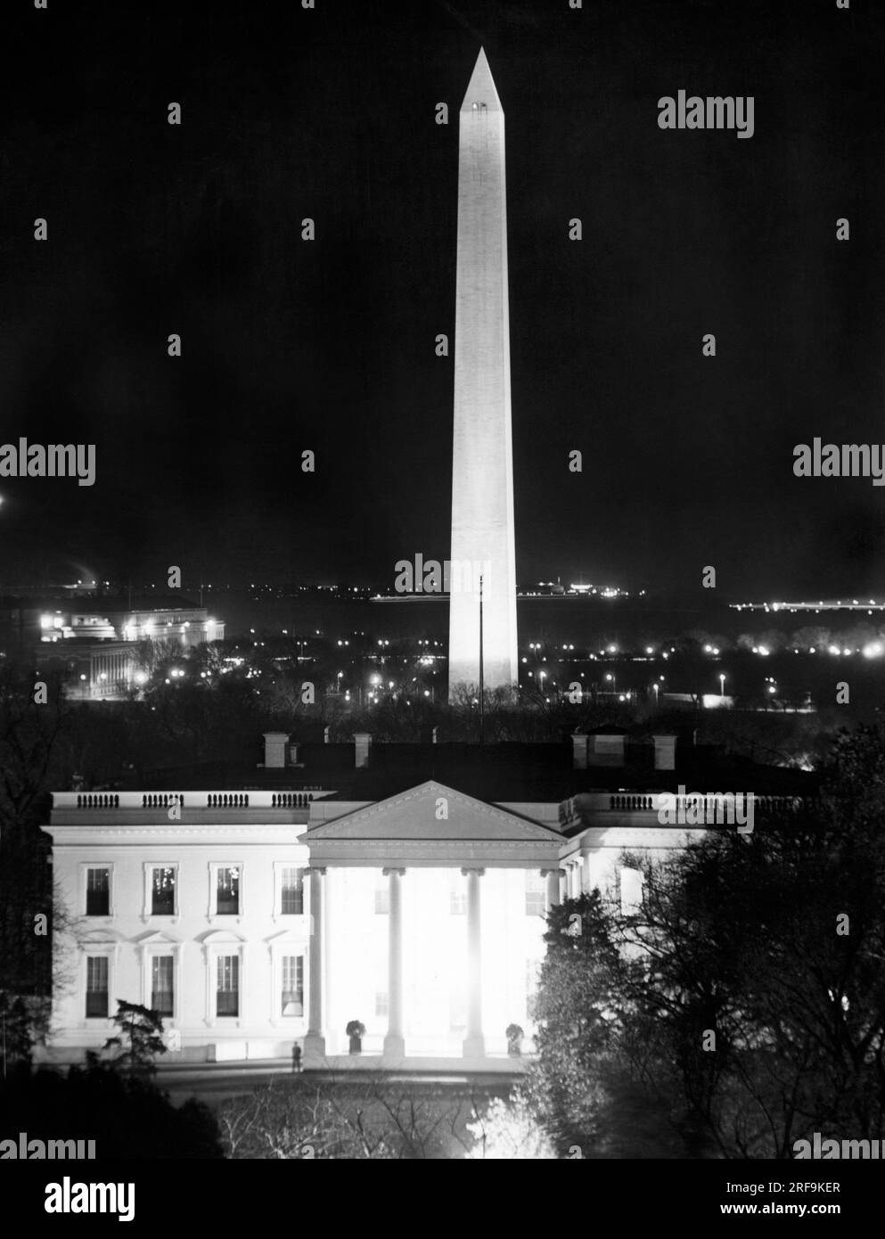 Washington, D.C.:   c. 1940 The White House with the Washington Monument behind it. Stock Photo