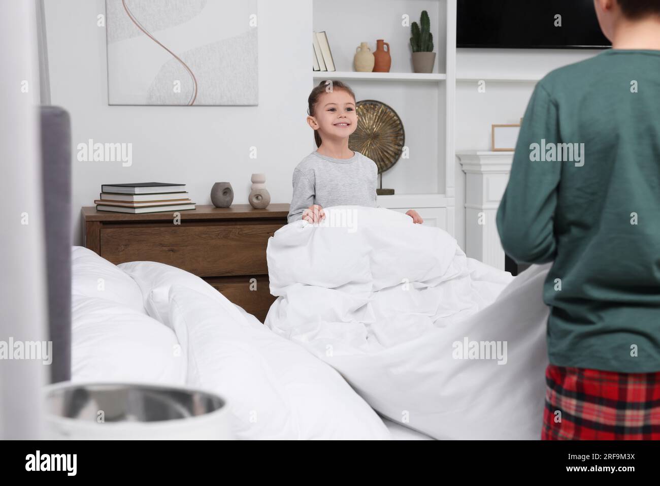 Sister changing clothes in front of brother