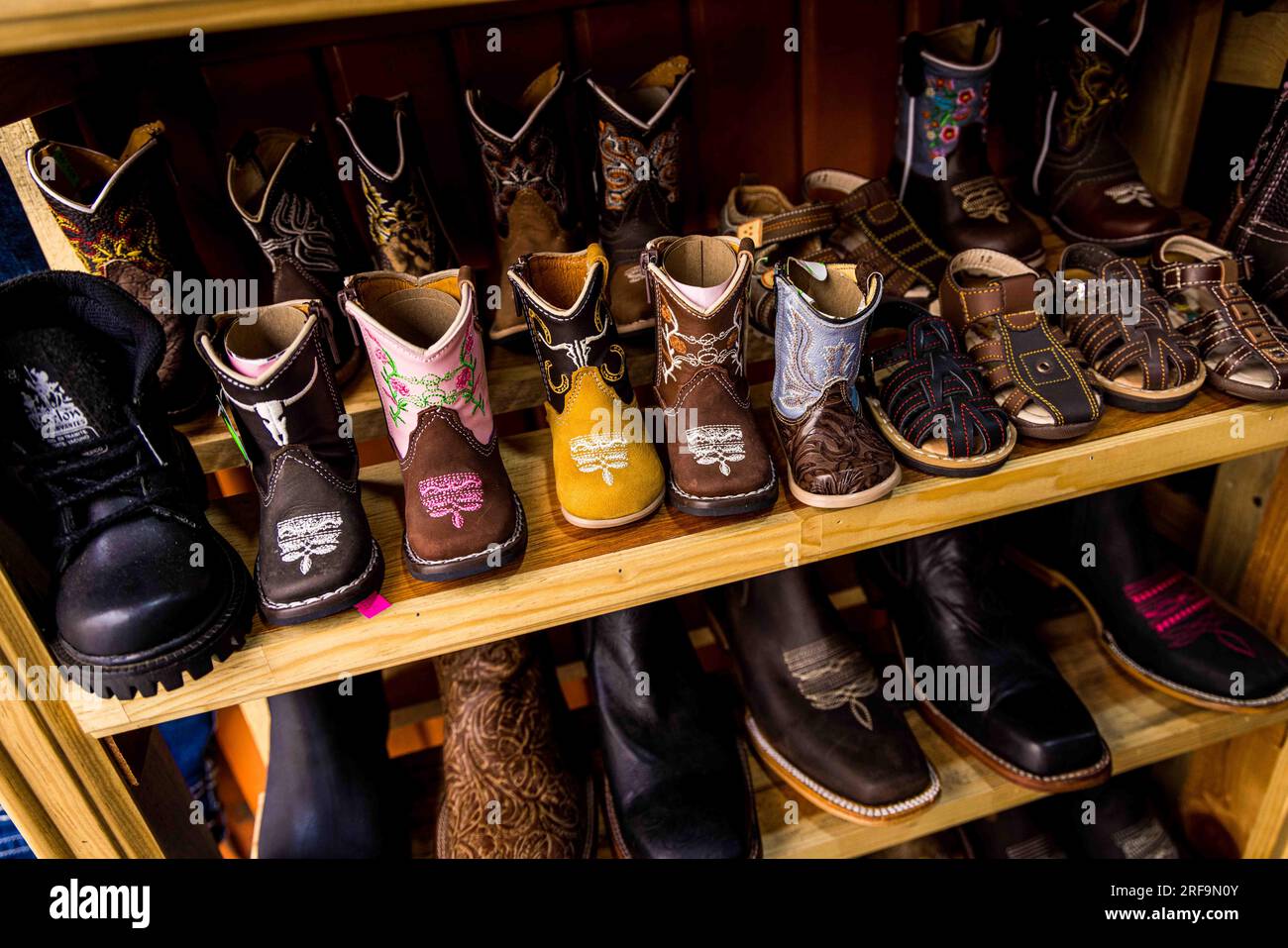 Cowboy boots and leather belts in a business showcase in the center of