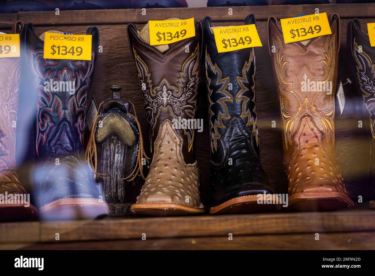 Cowboy boots and leather belts in a business showcase in the center of  Parral, Chihuahua, Mexico. Hidalgo de Parral Magic Town. Saddlery, footwear  and Stock Photo - Alamy