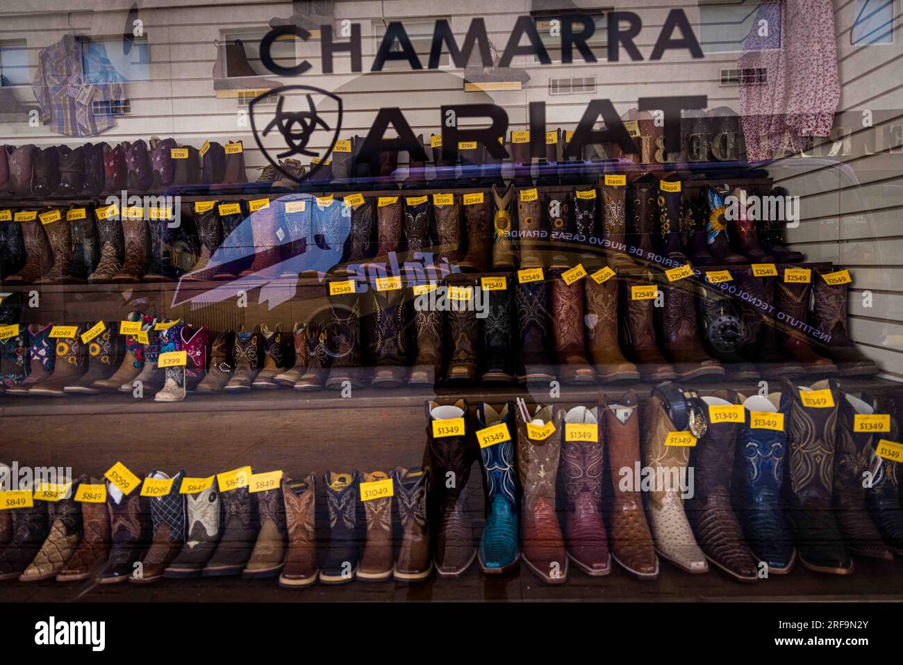 Cowboy boots and leather belts in a business showcase in the center of