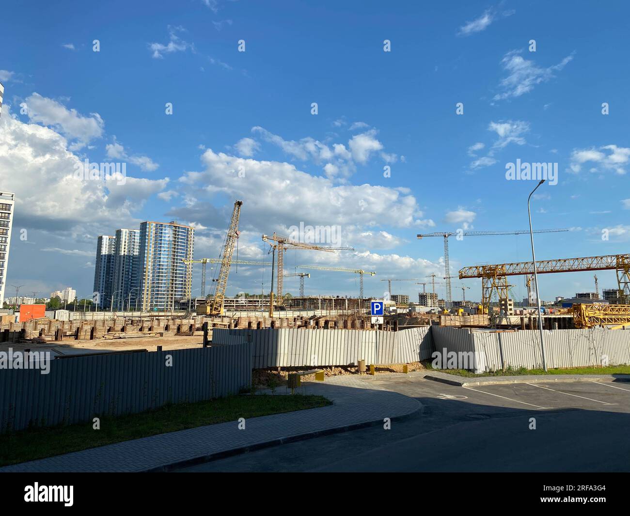Tall building under construction with scaffolds. Construction site ...