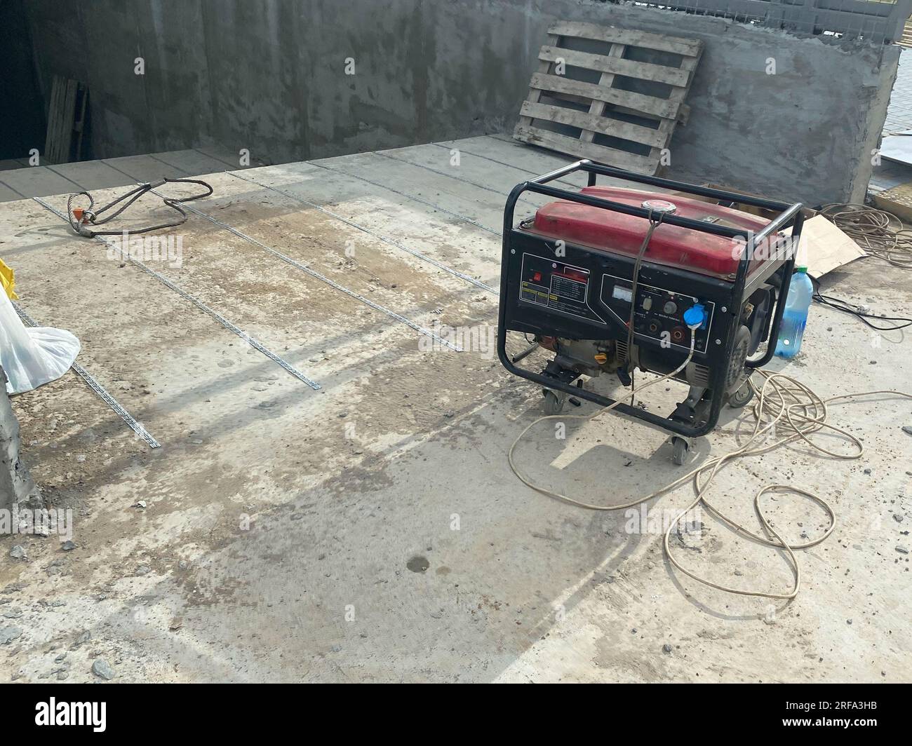 Large industrial red electric generator running on gasoline or kerosene