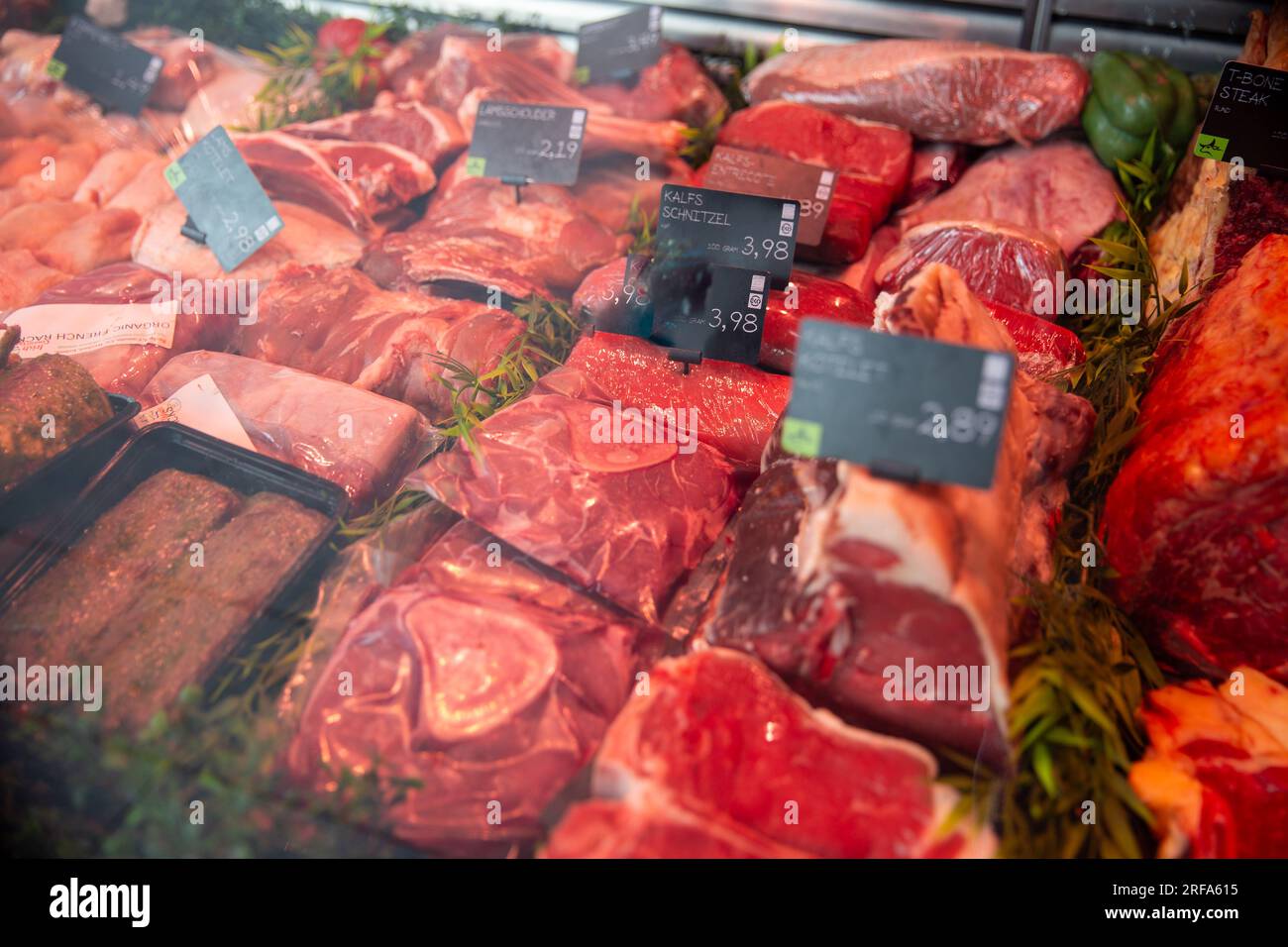 Variety of raw meat for sale at a butcher Stock Photo Alamy