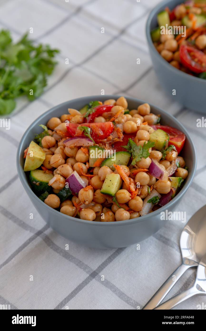 Homemade Avocado Chickpea Salad with Chili Lime Dressing in a Bowl, side view Stock Photo Alamy
