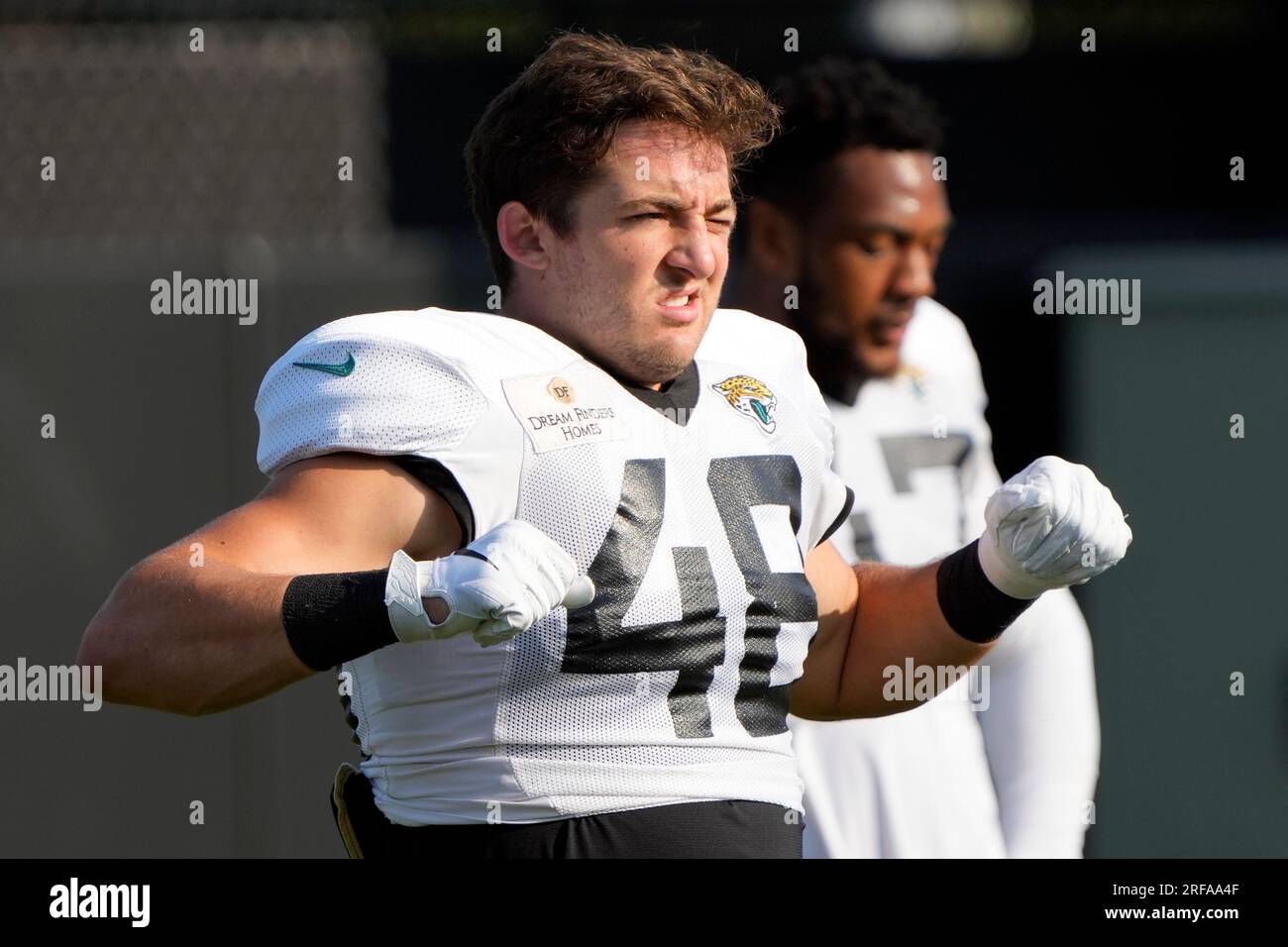 Jacksonville Jaguars linebacker Chad Muma (48) stretches during