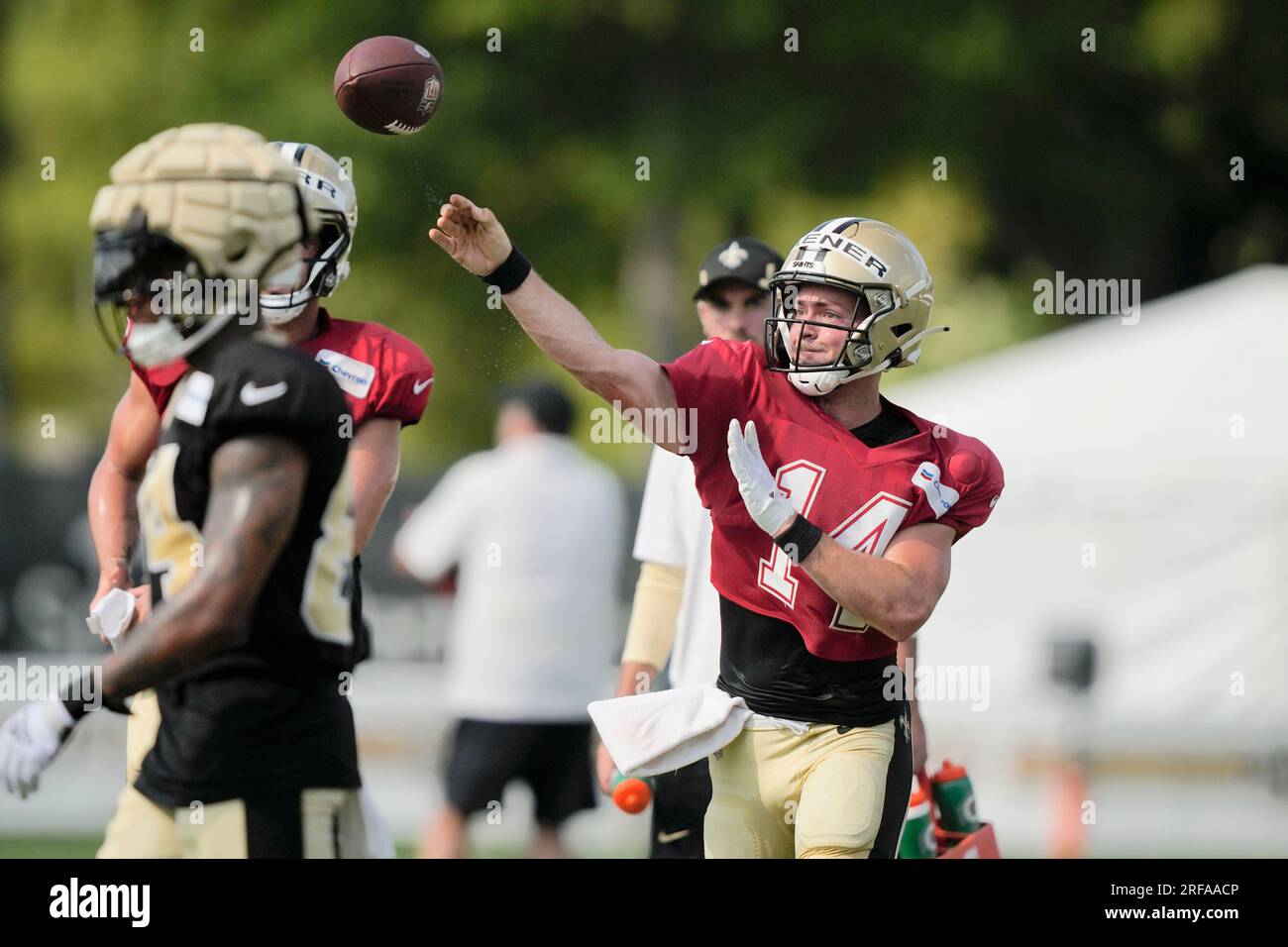 New Orleans Saints quarterback Jake Haener (14) runs through drills at the  NFL team's football training camp in Metairie, La., Friday, Aug. 4, 2023.  (AP Photo/Gerald Herbert Stock Photo - Alamy