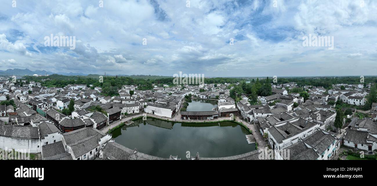 Jinhua. 1st Aug, 2023. This aerial photo taken on Aug. 1, 2023 shows the Zhuge Village of Lanxi City, east China's Zhejiang Province. The Zhuge Village, a historic gem with over 300 ancient buildings dating back to Ming and Qing dynasties (1368-1911), is home to descendents of Zhuge Liang, a renowned military strategist in the Three Kingdom Period (220-280). The village has made concerted efforts to preserve the ancient heritages and develop tourism, receiving over 500,000 visitors annually. Credit: Weng Xinyang/Xinhua/Alamy Live News Stock Photo