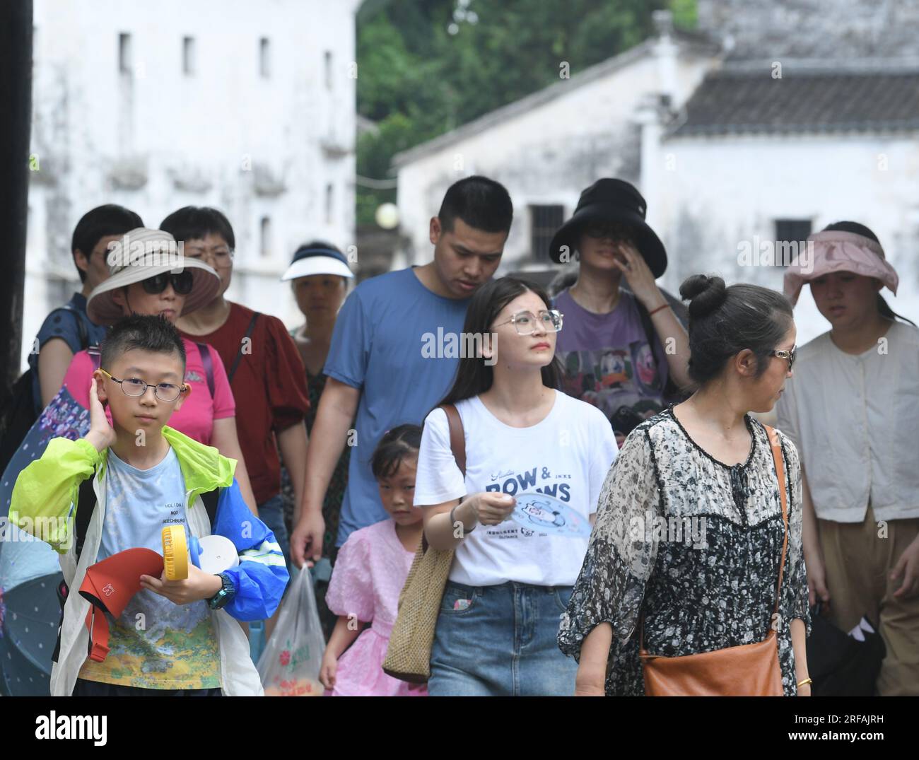 Jinhua, China's Zhejiang Province. 1st Aug, 2023. Tourists visit the Zhuge Village of Lanxi City, east China's Zhejiang Province, Aug. 1, 2023. The Zhuge Village, a historic gem with over 300 ancient buildings dating back to Ming and Qing dynasties (1368-1911), is home to descendents of Zhuge Liang, a renowned military strategist in the Three Kingdom Period (220-280). The village has made concerted efforts to preserve the ancient heritages and develop tourism, receiving over 500,000 visitors annually. Credit: Weng Xinyang/Xinhua/Alamy Live News Stock Photo