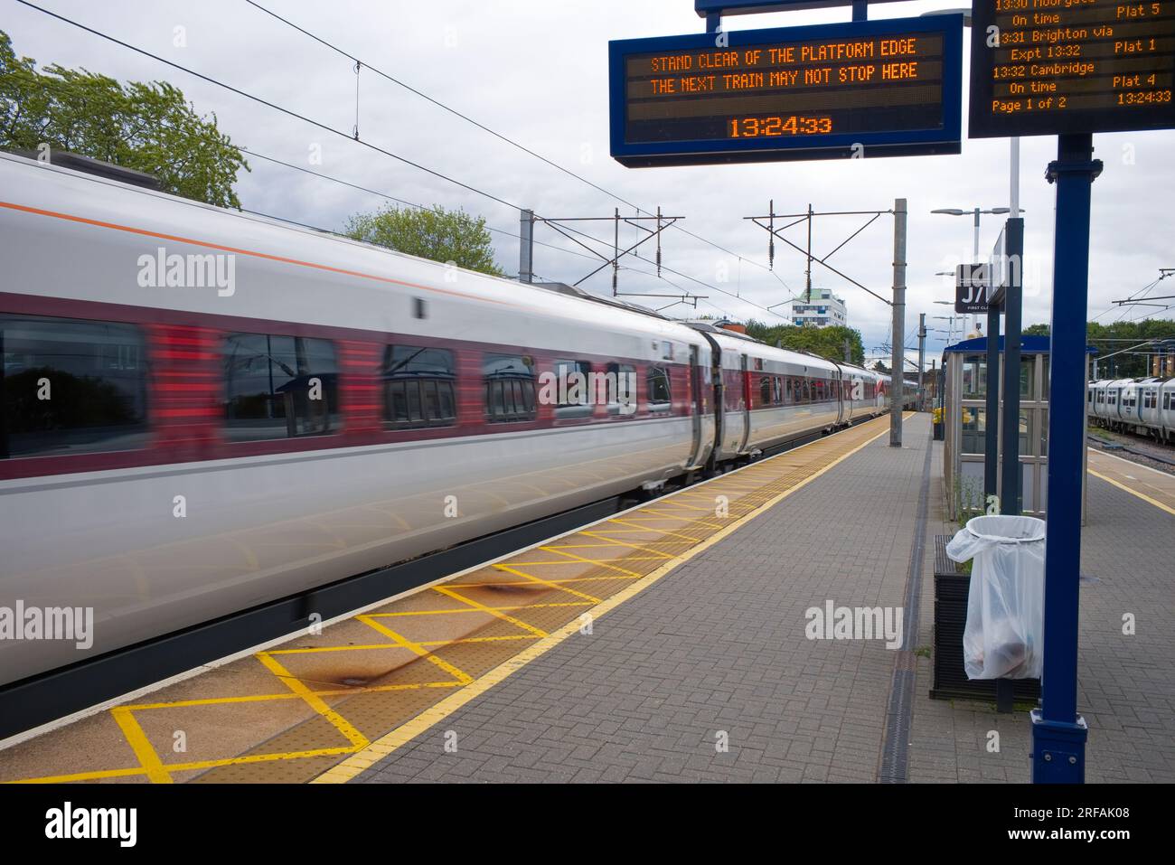 A fast through train passing through Stevenage railway station Stock Photo