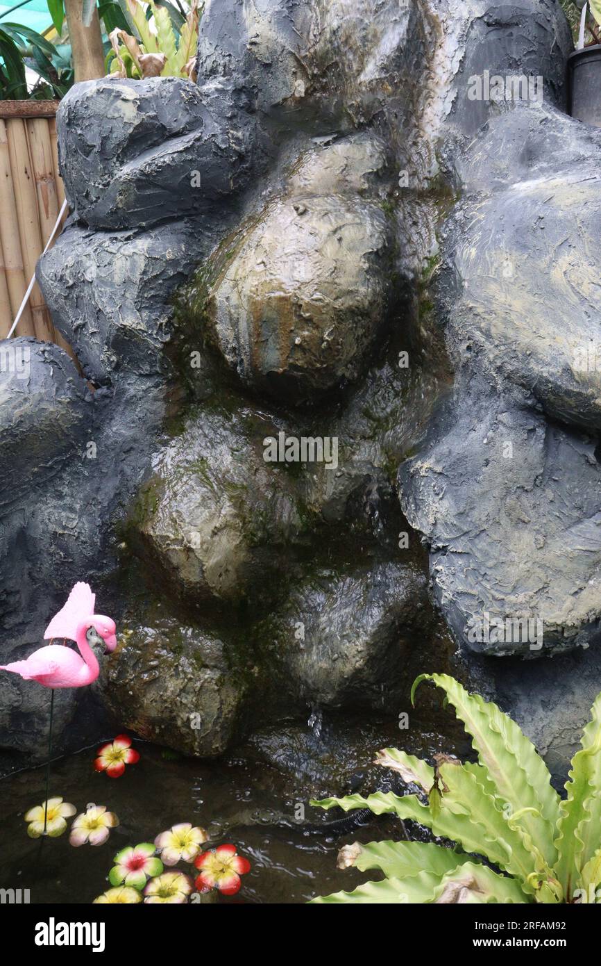 Small Artificial Rock Waterfalls on waterfall park Stock Photo