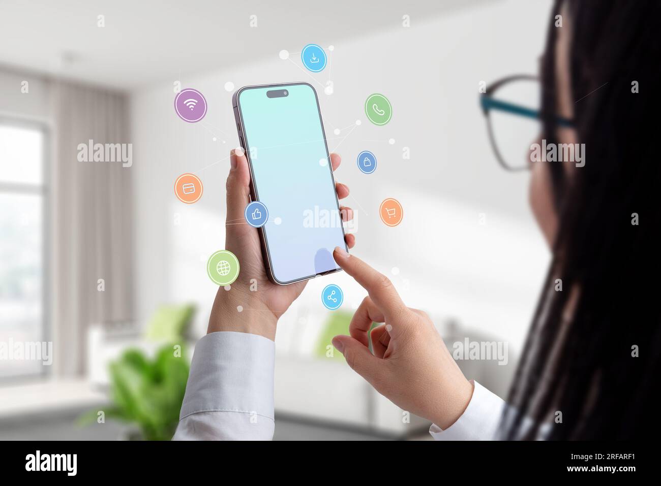 Social media icons, network nodes and smart phone in woman hands. Woman touch display of smart phone concept Stock Photo