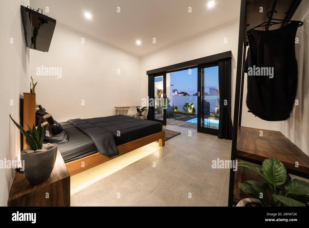 Luxury bedroom with modern wooden bed in loft style interior design ...