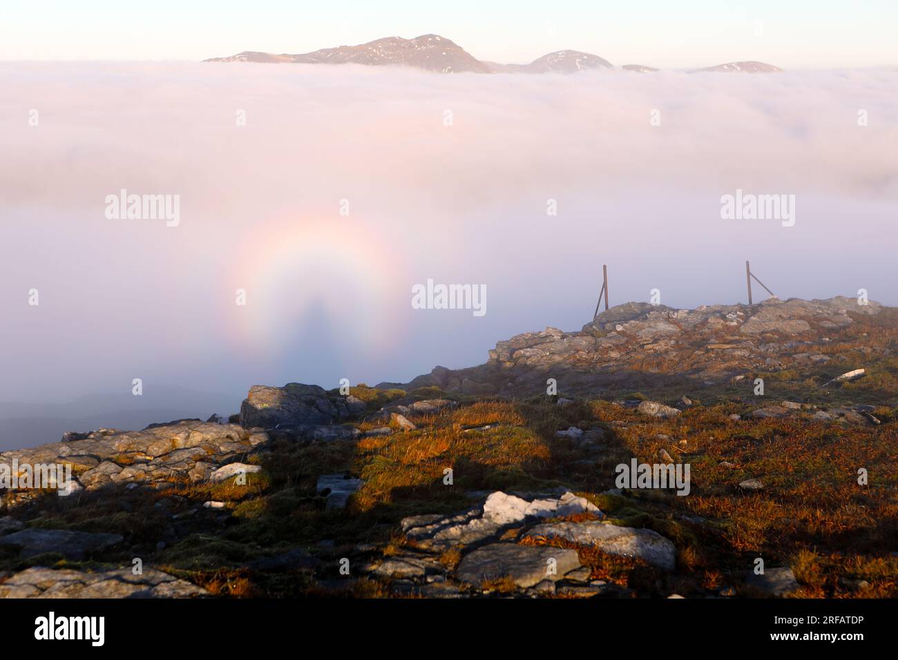 Brocken spectre with glory rings at the summit of Beinn Chuirn, Tyndrum, Scotland Stock Photo