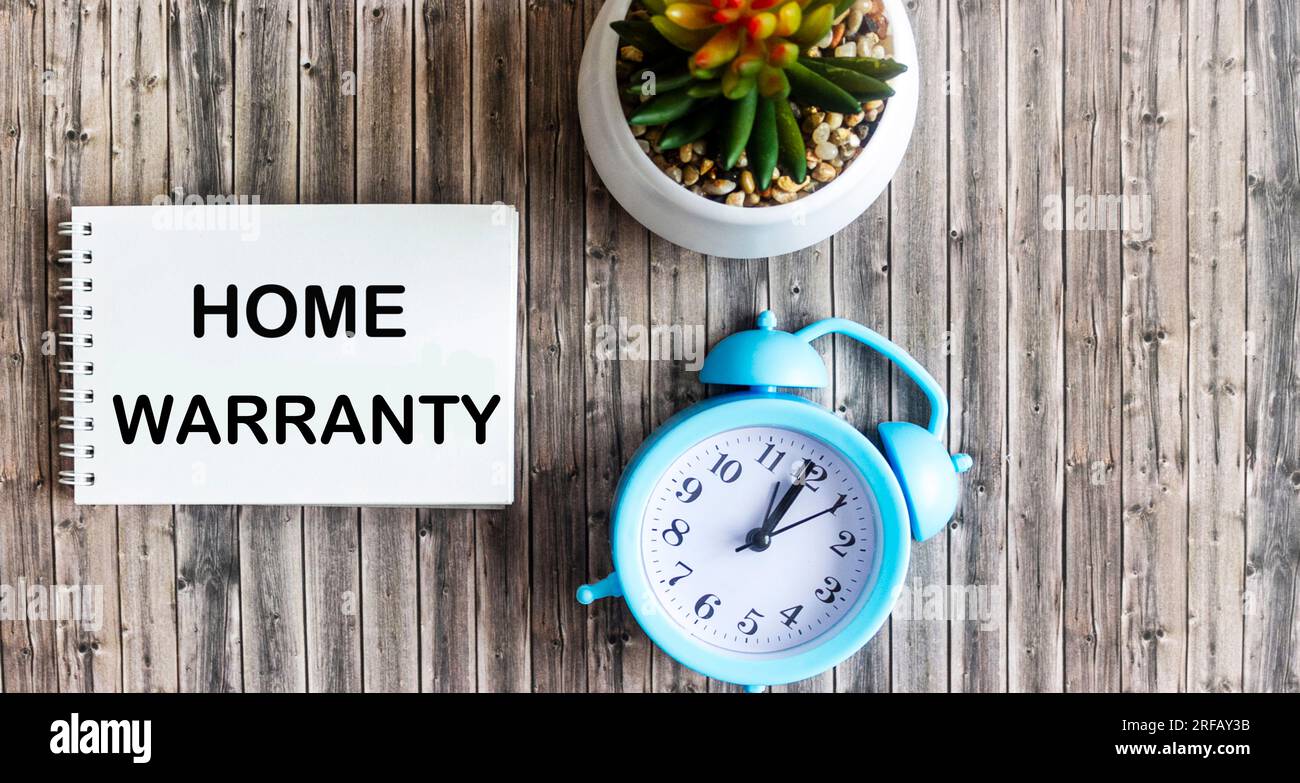 Home Warranty shown in photo with text on notepad Stock Photo