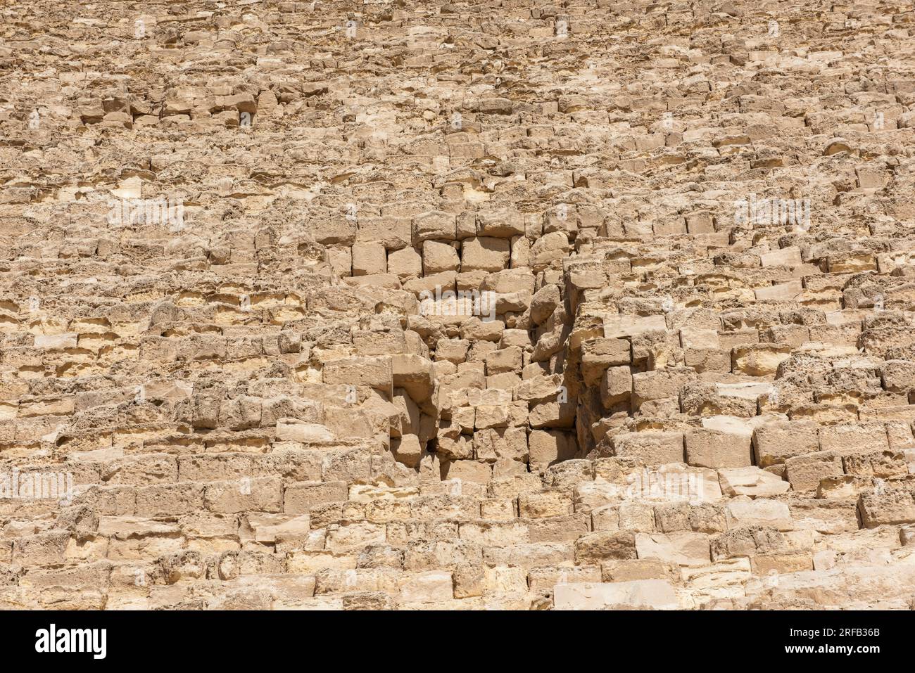 Entrance door hidden in side wall of ancient egyptian stone pyramid in Cairo Egypt Stock Photo