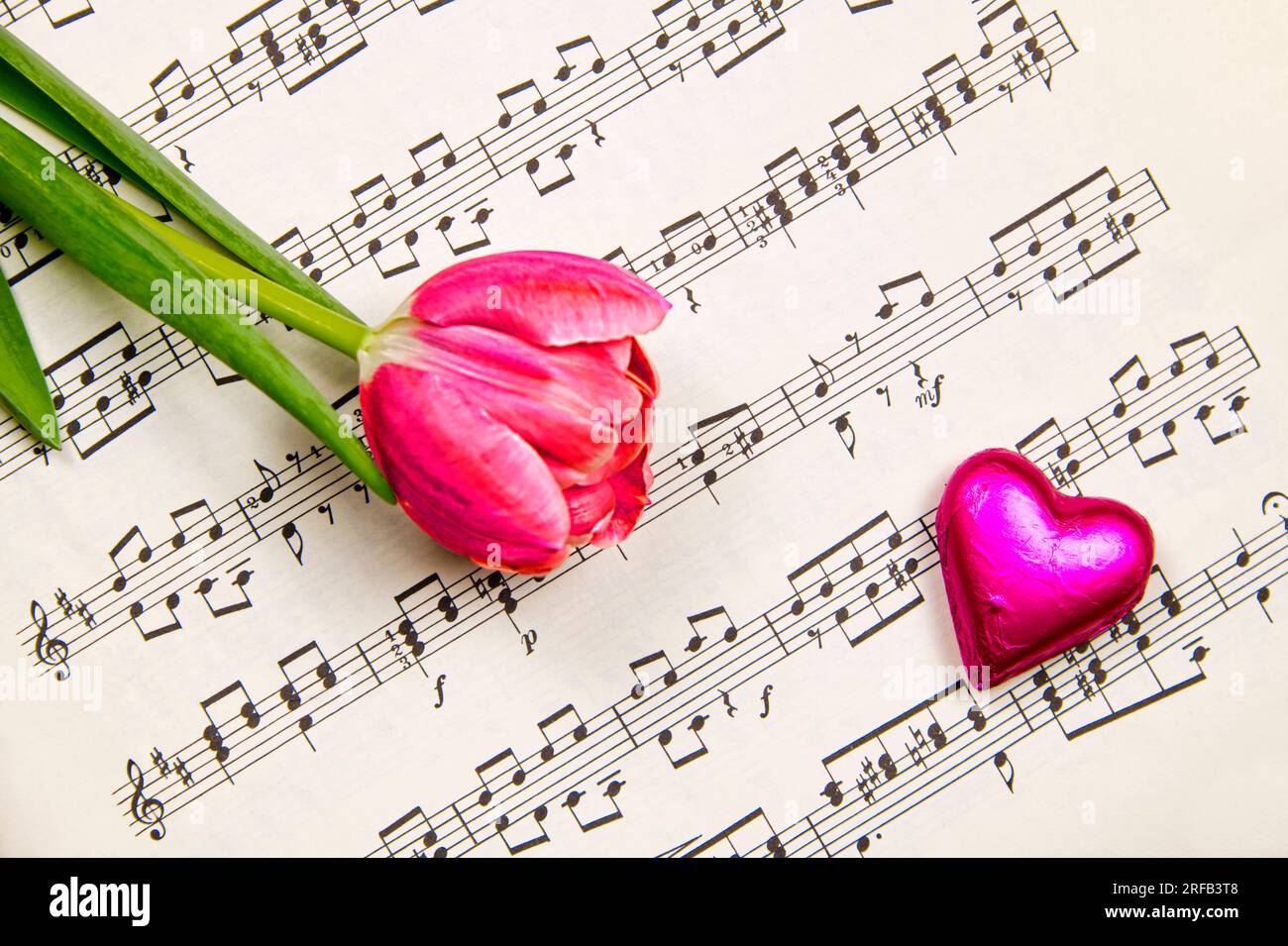 Music, flowers and chocolate to express the love feelings Stock Photo