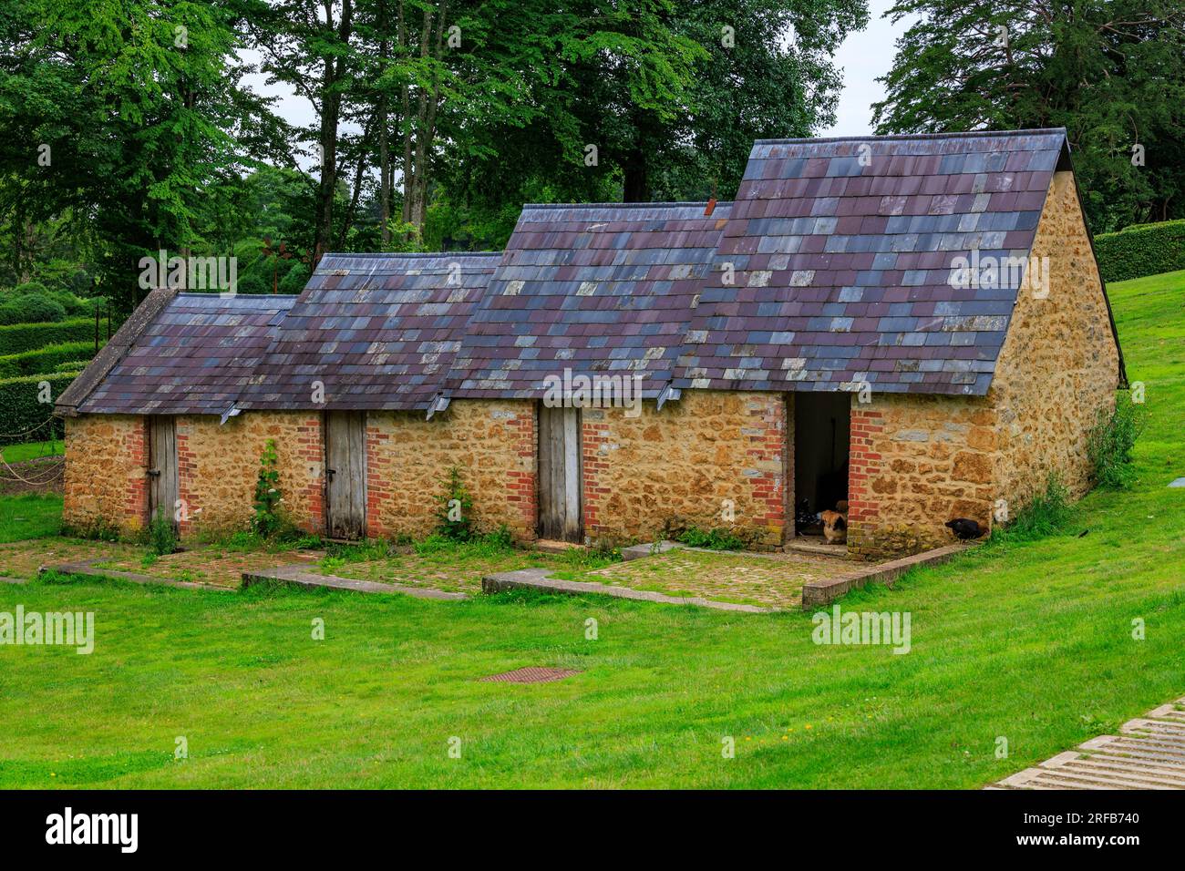 The interesting stepped slate roofs of the Fowl House at 'The Newt in Somerset', nr Bruton, England, UK Stock Photo