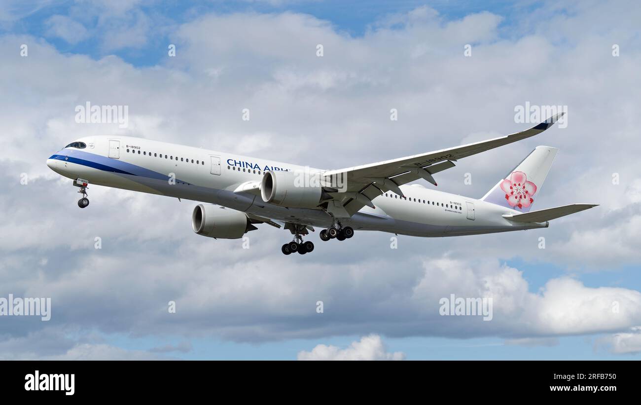 China Airlines Airbus A350 pink flower tail plane landing at London's