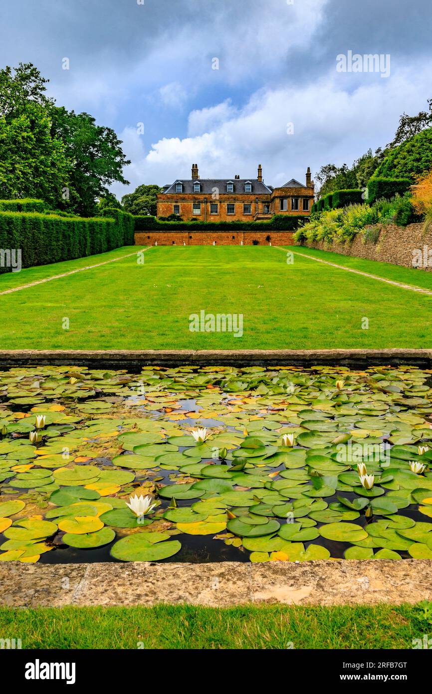 Water lilies and Hadspen House Hotel at the end of The Long Walk at