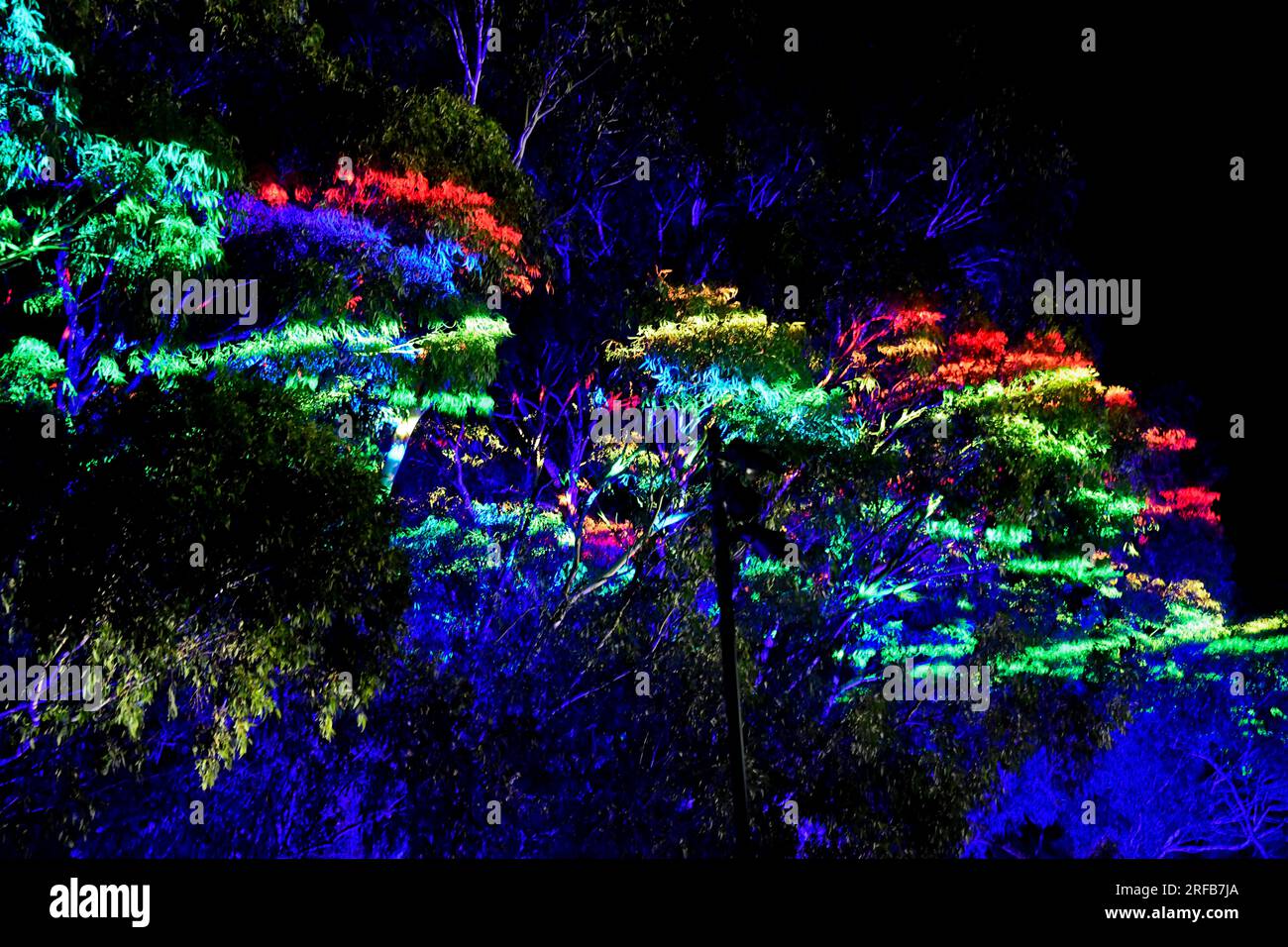 LIT Colourful Laser Light Show Beaming Colorful Patterns Across Smokey Night Sky Werribee Melbourne Victoria Australia Stock Photo