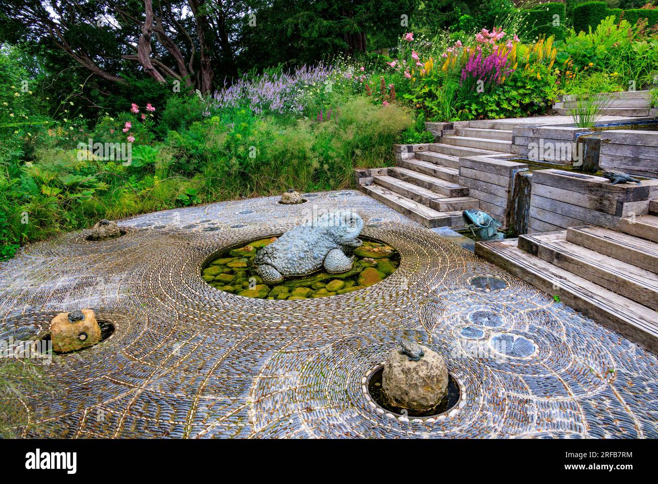 The Cascade Garden has an unusual frogs shooting water jets feature at 'The Newt in Somerset', nr Bruton, England, UK Stock Photo