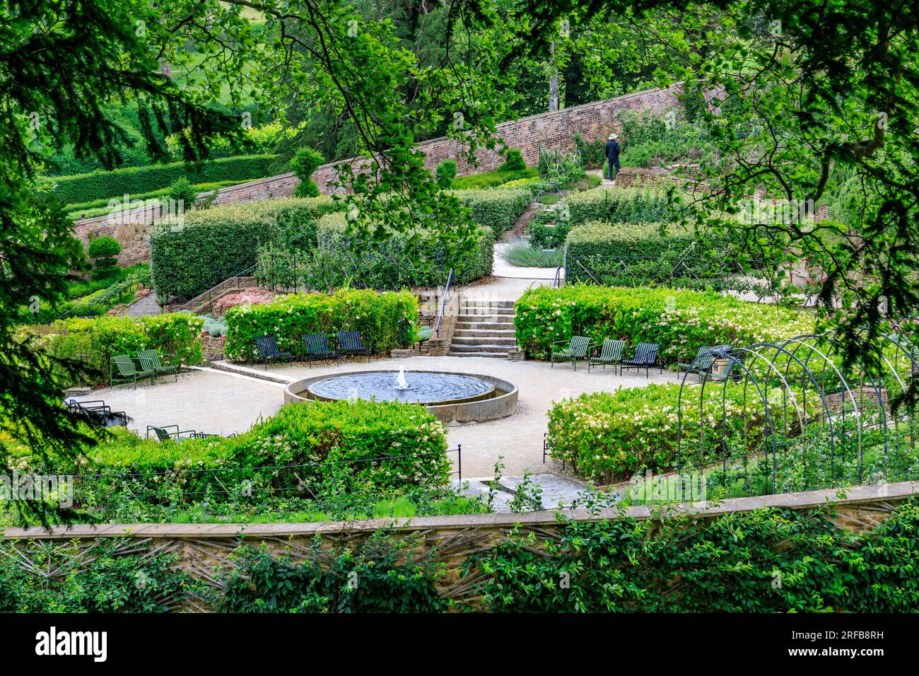 The Parabola walled garden contains many of the different varieties of English apple trees at 'The Newt in Somerset', nr Bruton, England, UK Stock Photo