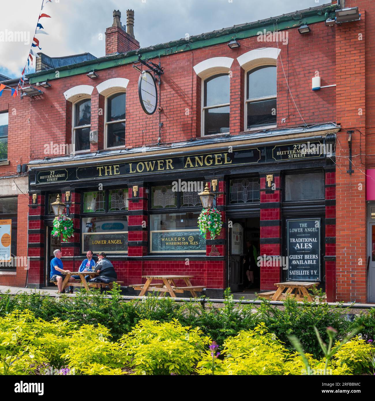 Buttermarket Street's historic and well loved pub in Warrington The Lower Angel with its tiled facade. Stock Photo