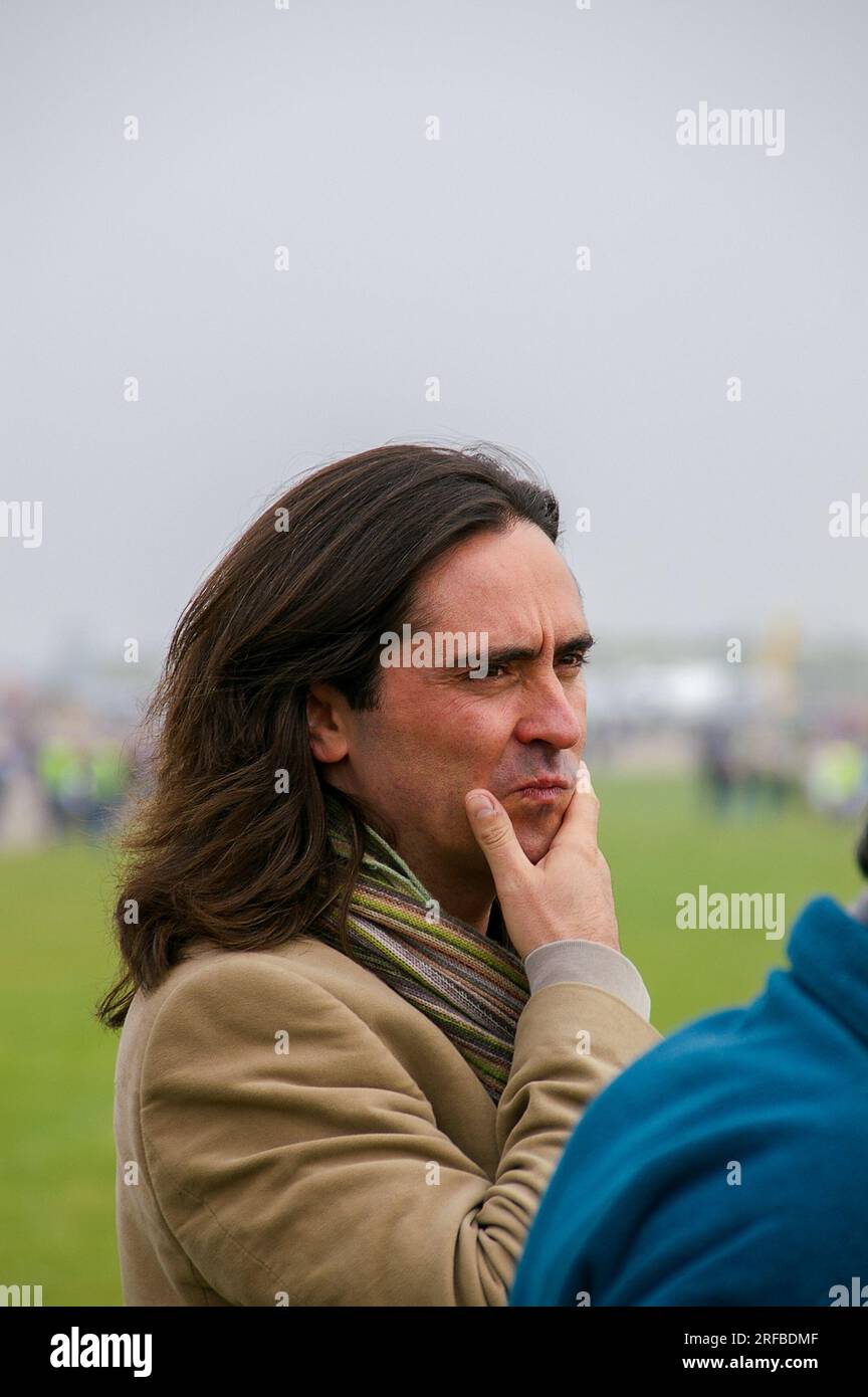 Neil Oliver, TV presenter, filming at Duxford, UK. Thinking appearance